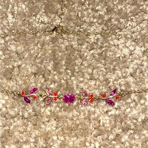 Fancy gold necklace with pink and purple jewels